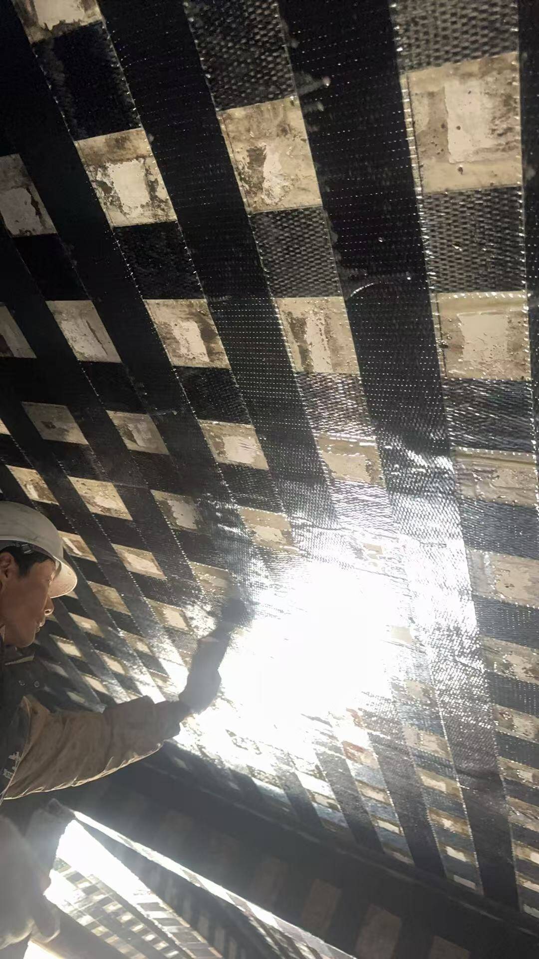 Carbon Fiber Sheet Strengthening of Concrete Structures